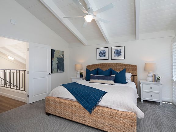 Primary bedroom with en suite bathroom and king size bed