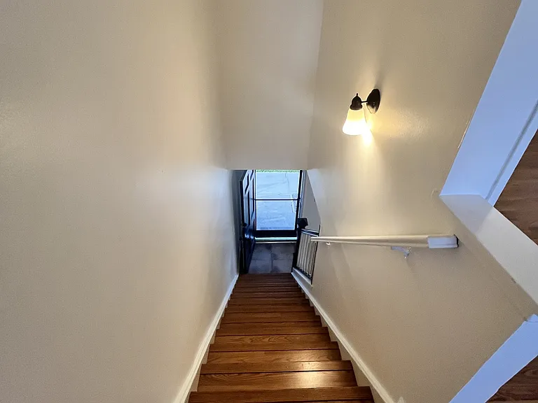 Staircase with laminate floors, nice white paint