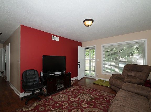 Living room with view of dining.