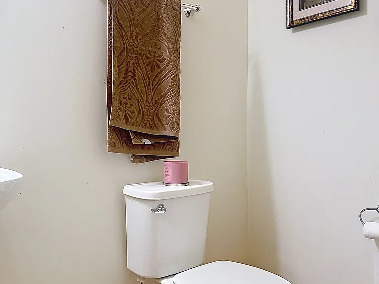 1/2 bathroom at the entrance from the laundry and by the family room
