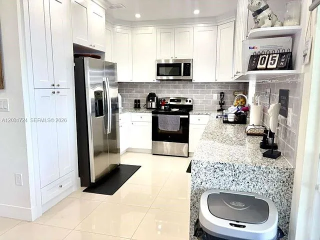 677 NW 170th Ter — Photo 13