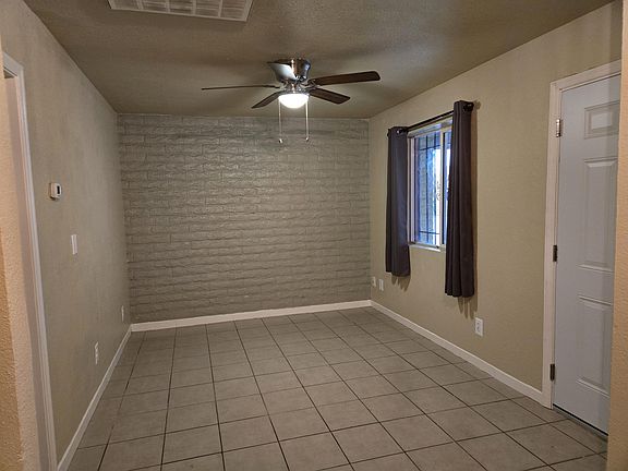 Living Room has new paint and brick accent wall.