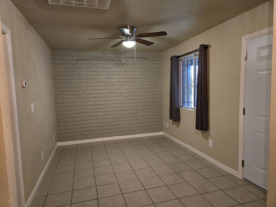 Living Room has new paint and brick accent wall.
