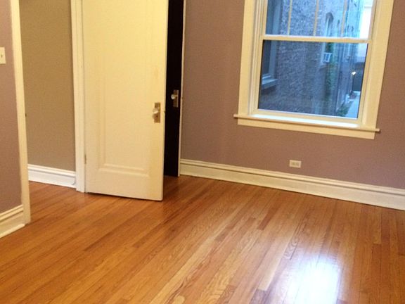 Bedroom, facing North (and facing rear courtyard).