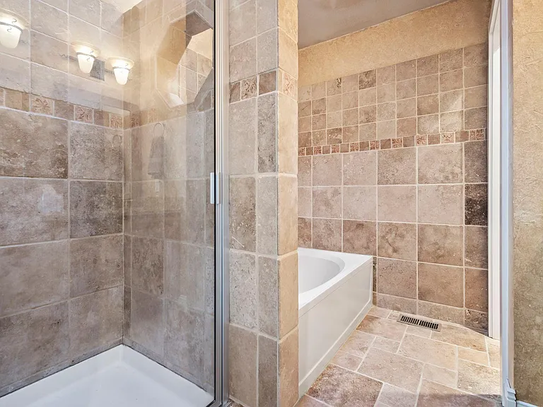 Soak in the oversized bathtub or standing shower.