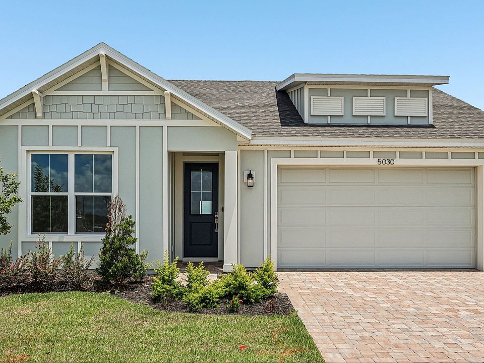 Longleaf Floor Plan Exterior with Paver Driveway and Walkway New Homes in St. Cloud at Lakeside at S