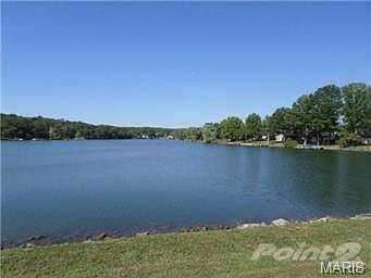 This property fronts the lake. The home is located towards top r