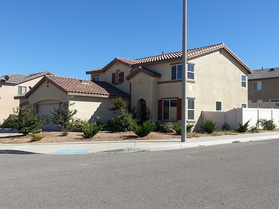 Front view with Desert Landscaping and great curb appeal.