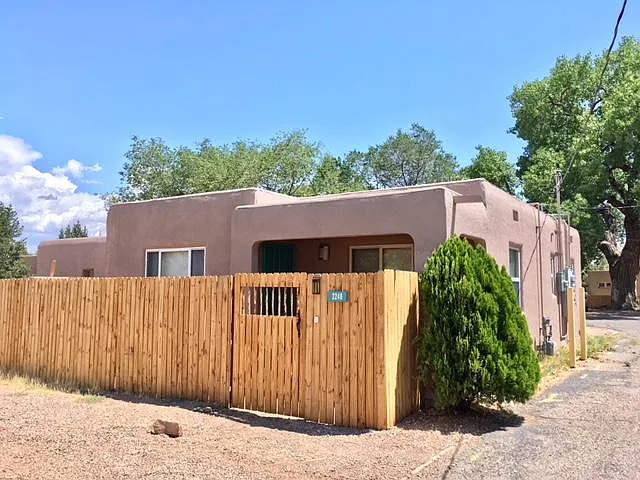 Gated courtyard to entry, 2 large parking spaces in front of home.
