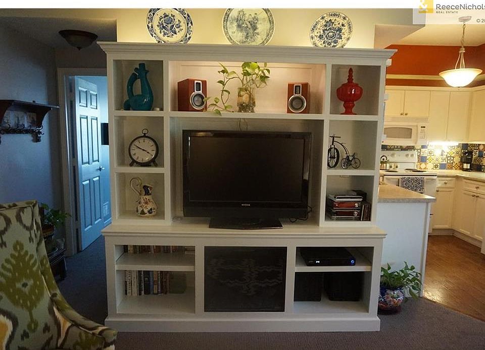 Custom built entertainment center with electric fireplace.