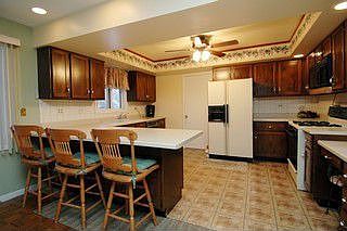 Kitchen with newer ceiling fan 