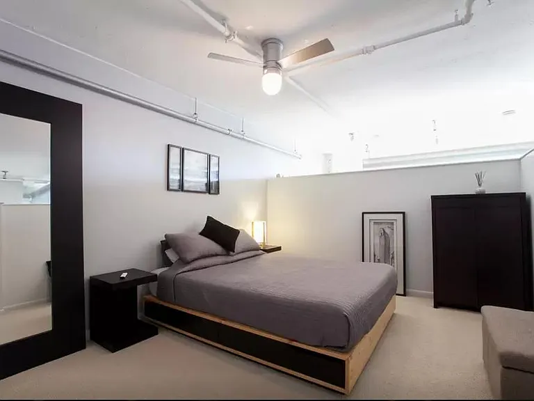 bedroom before carpet repaced with wood floor