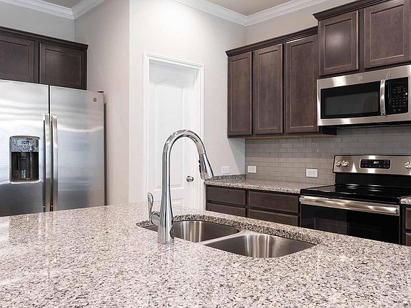 Beautiful kitchen with granite countertops and stainless steel appliances