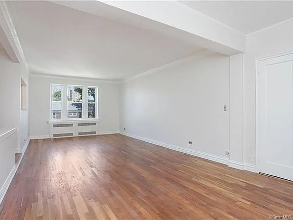 Living room and two closets at entry