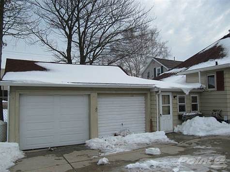 2 car attached garage behind home