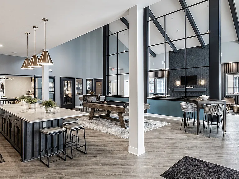 The clubhouse is a community space for residents to relax, play games, shoot pool, or work.
