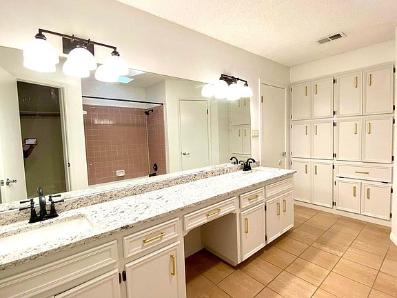 Adorned with a fresh coat of paint and sleek, modern fixtures, the cabinets exude a renewed charm and contemporary allure