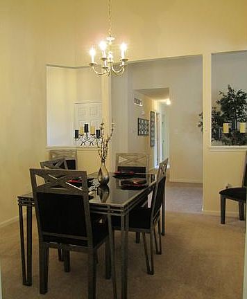 Formal dining room with vaulted ceilings