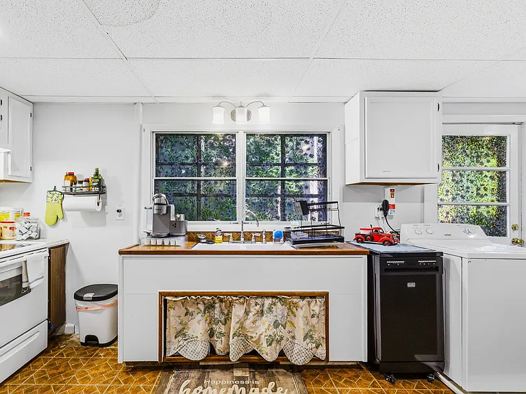 TERRACE LEVEL: Kitchen and Laundry (on right), (Dining on right)