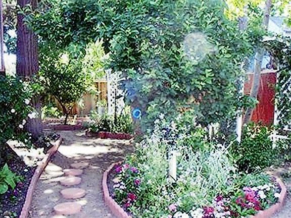 backyard paths and flower beds galore