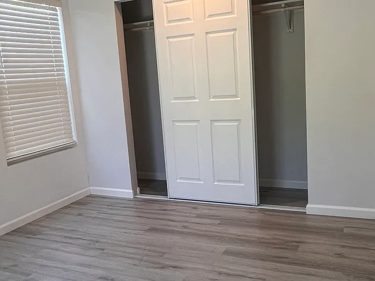 First bedroom with ample closet and window