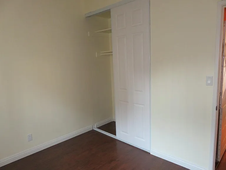 View of closet in bedroom.