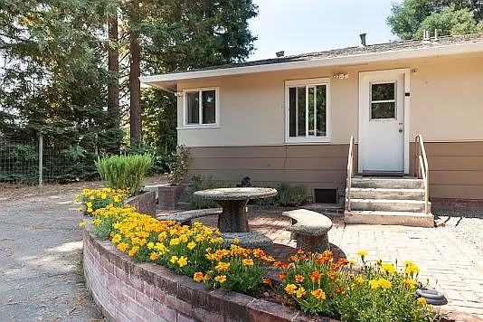 Left side of back entrance with seating area