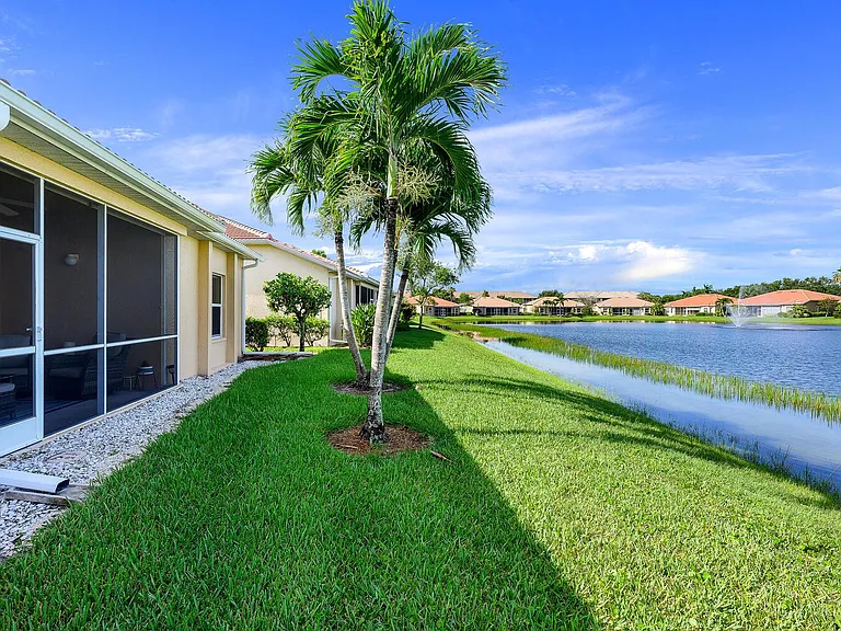 Behind the home, overlooking a neighborhood lake