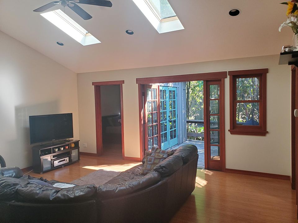 Living room with high ceilings and skylights