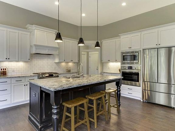 Gourmet-style kitchen with custom cabinets.