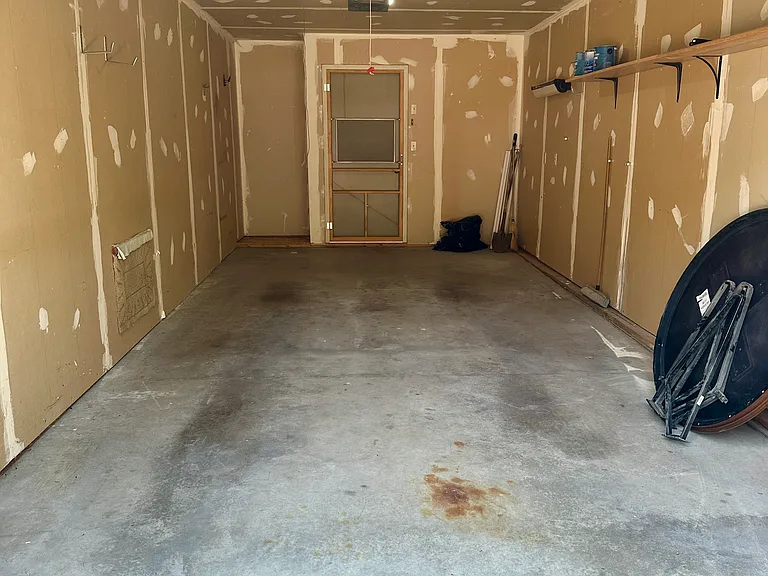 Attached one car garage with garage door opener.