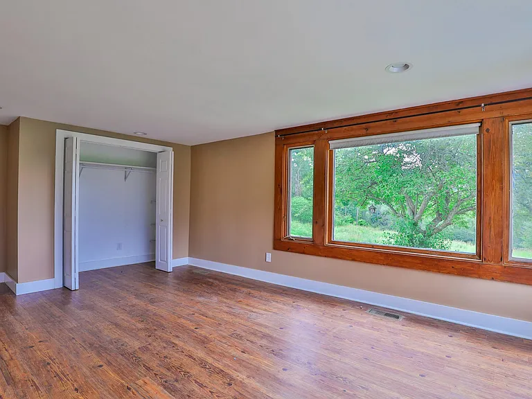 Master bedroom picture window and large closet