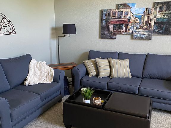Living room: full sofa, love seat, upholstered chair.