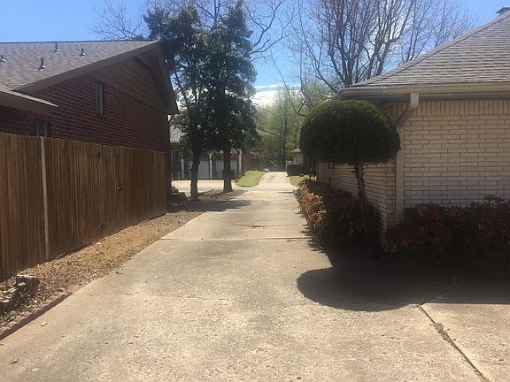 Drive way on side going to garage area and extra parking