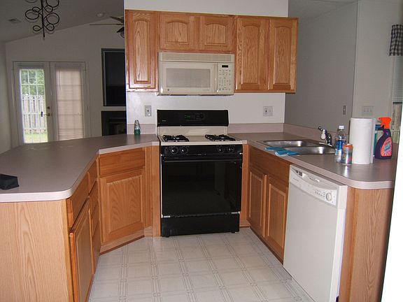 Kitchen with Gas Stove, Over Stove Microwave and Dishwasher