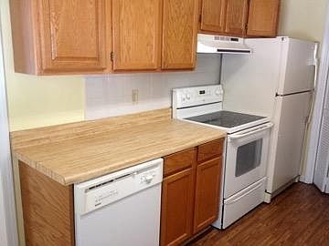 diswasher and stove.  laundry area just past frig.