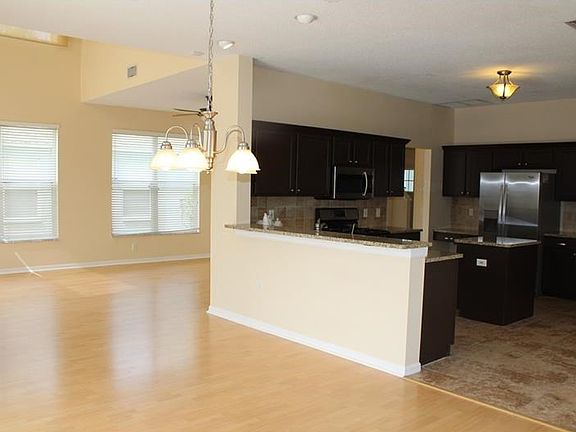 View of the L-shaped Dining and Living rooms.