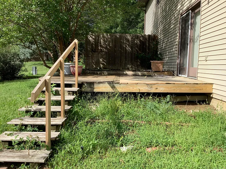 Large two tiered deck on west side of the duplex with French door out to deck