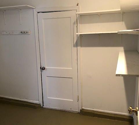 Utility room between kitchen and garage provides additional storage.