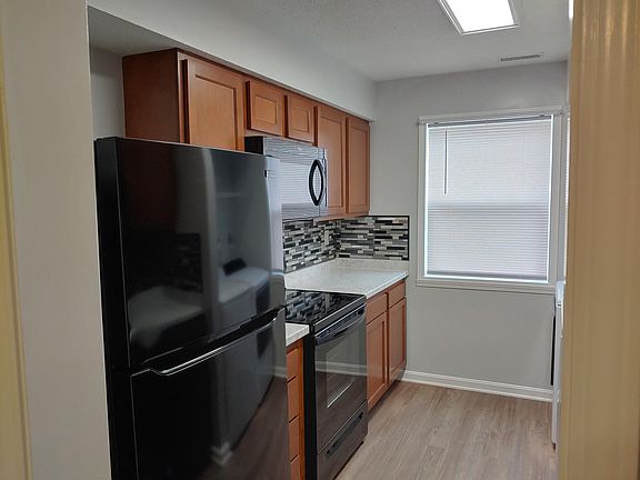 New refrigerator, range and microwave, flooring.