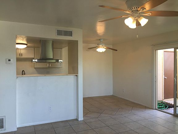 Looking in dining room and kitchen area