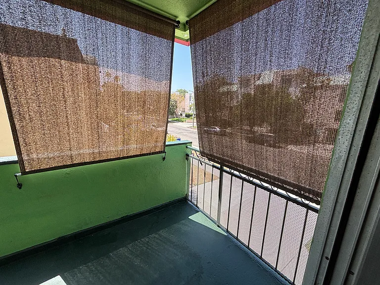 Balcony with retrackable shades.