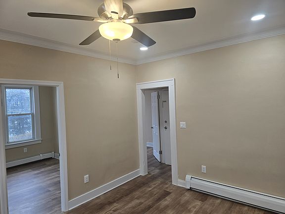Open Concept living room with Recessed Lighting & Ceiling Fan
