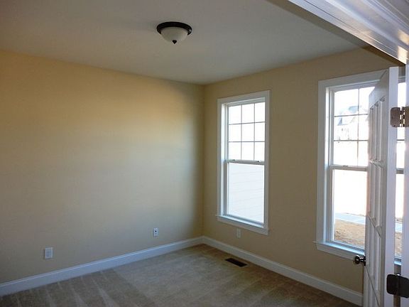Home office/study to right of main entrance has French doors for privacy.
