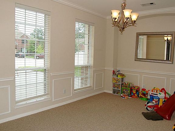 This formal area has lovely trim and could also be used as a study.