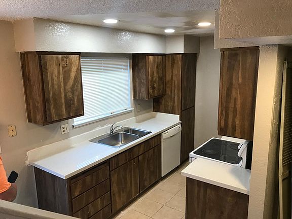 New Quartz countertops. Save on electricity with LED canned lights.