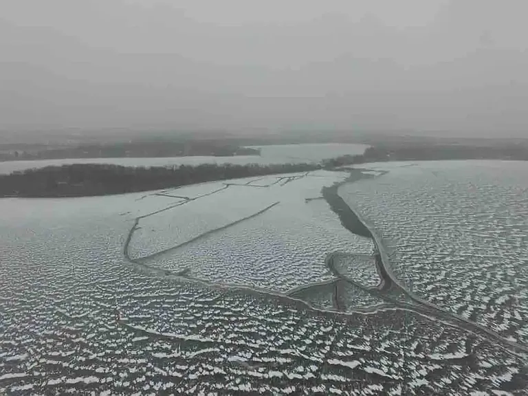 ariel view of lake in winter
