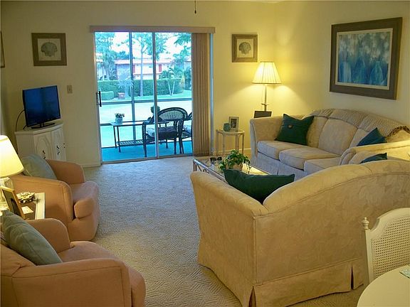 Living room with sliding glass doors out to the balcony with great views