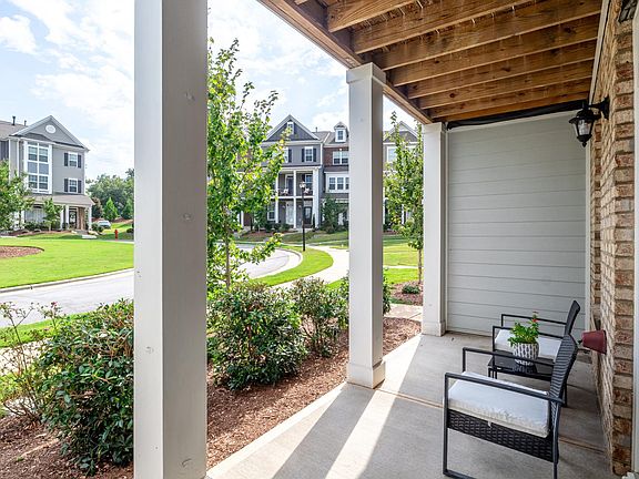 Front porch facing huge lawned cul-de-sac