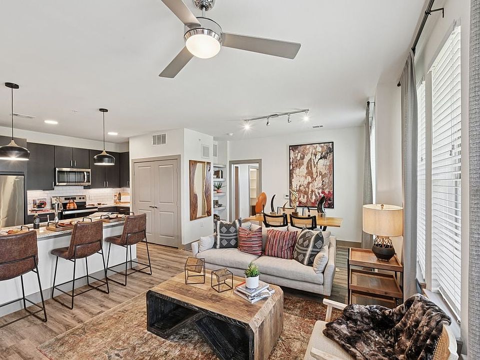 Kitchen, living, and dining area with hard surface flooring